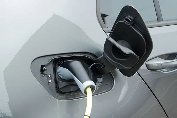 Electric charger inserted into charging socket of plug-in hybrid vehicle